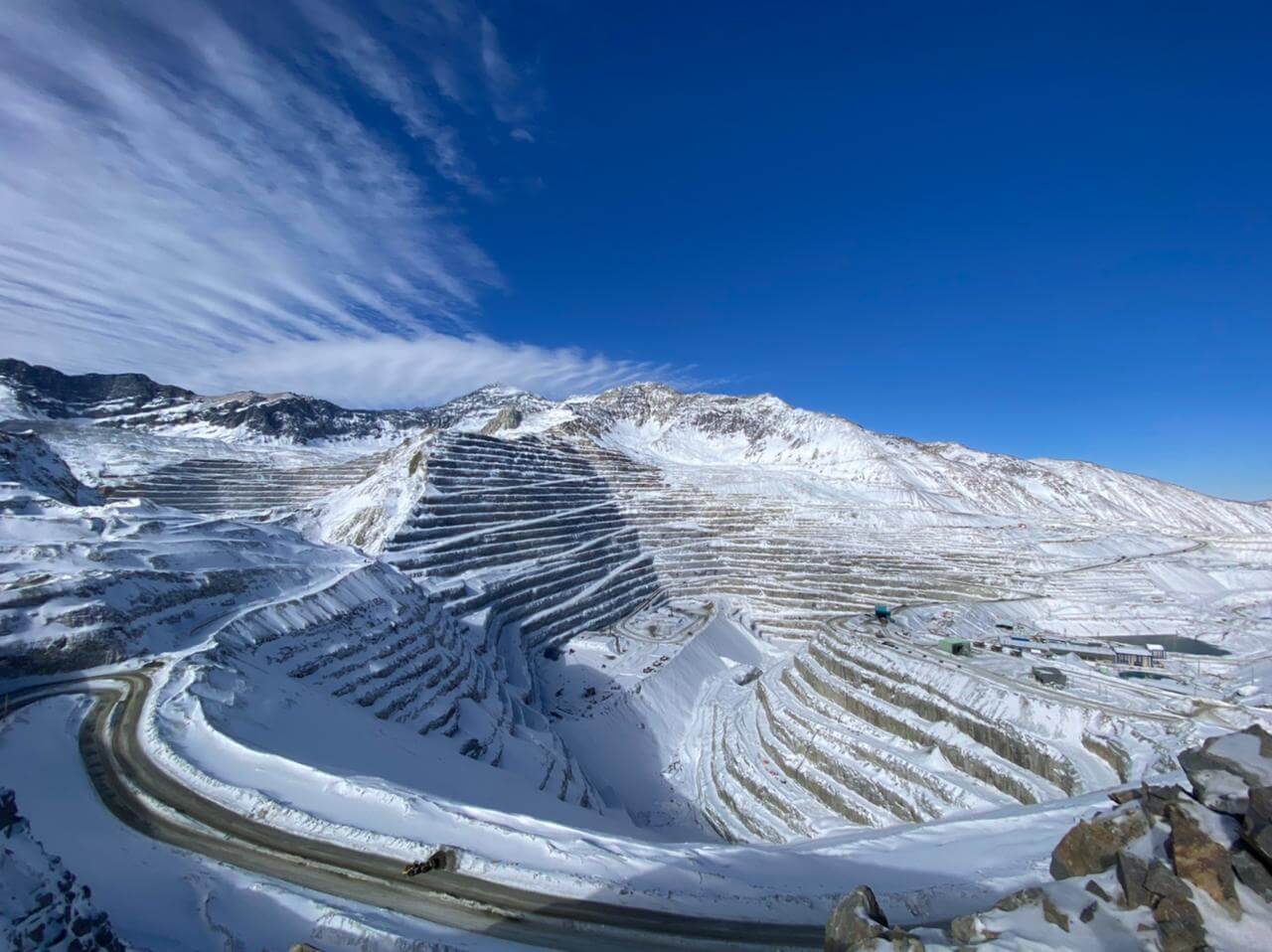 Snow-covered open-pit mine high in the Andes