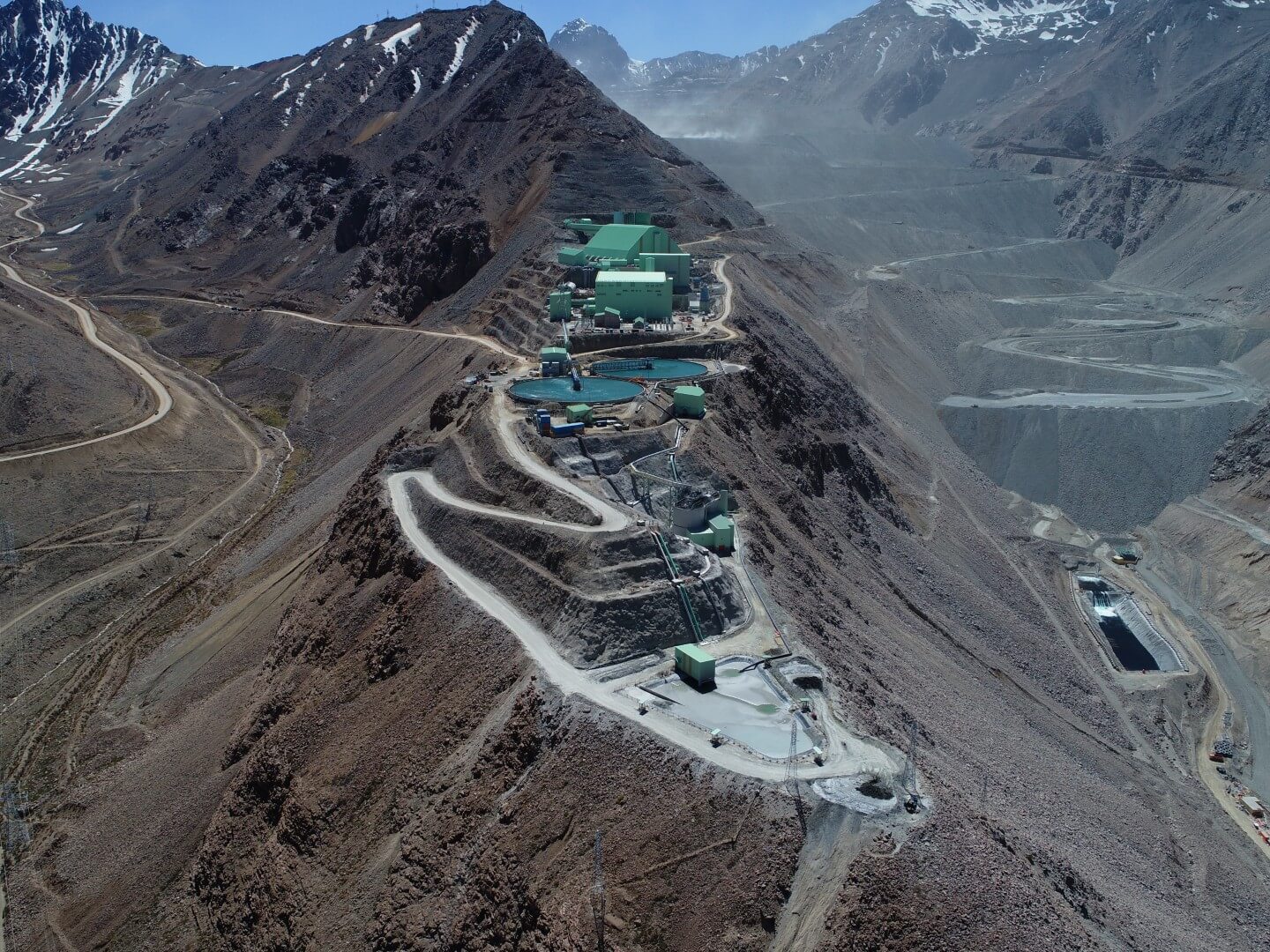 Aerial view of a high-altitude mine site and access road in the Andes