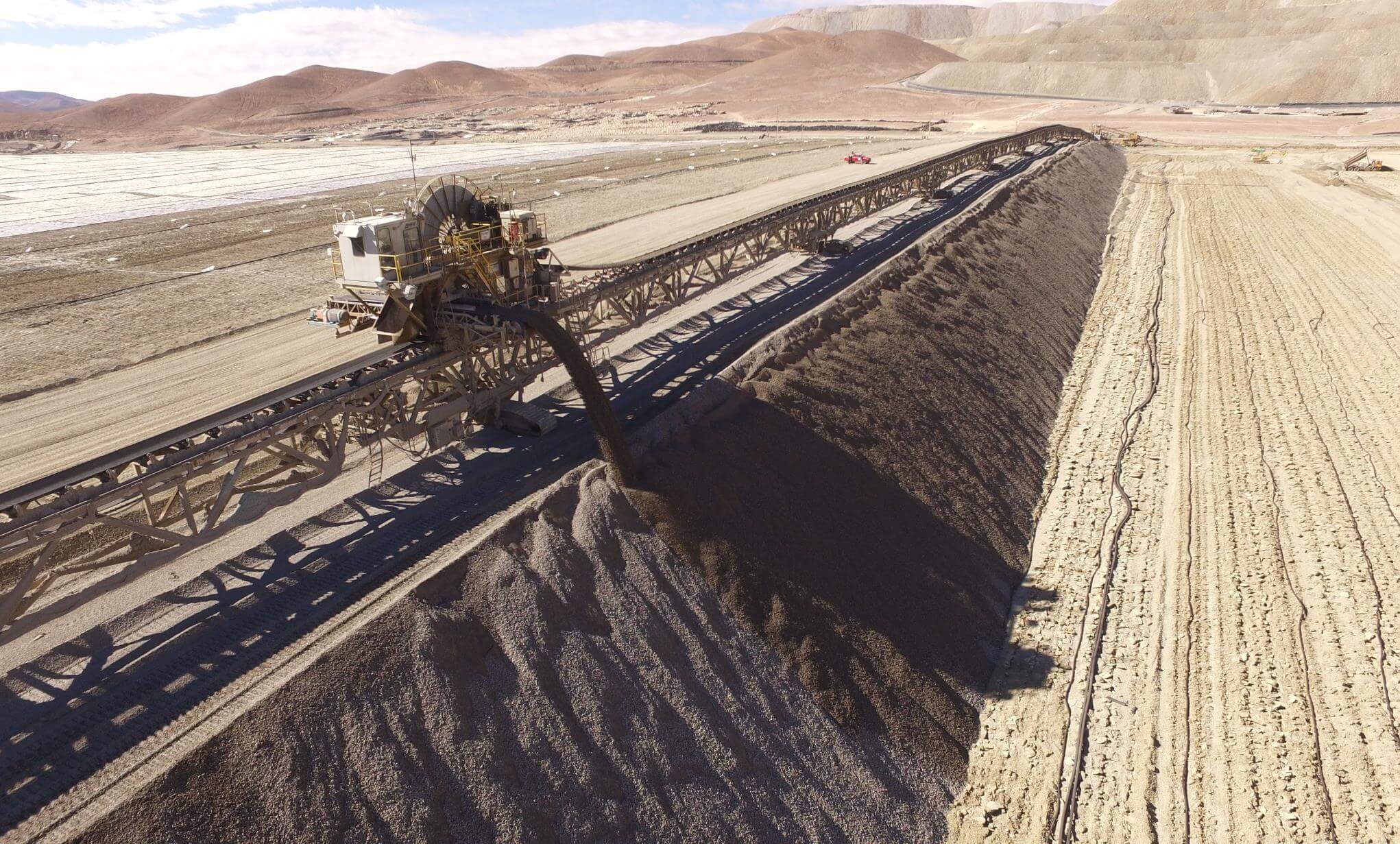Mine stacker conveyor building a heat leach ore stockpile Zaldívar copper mine in the Atacama Desert, Chile
